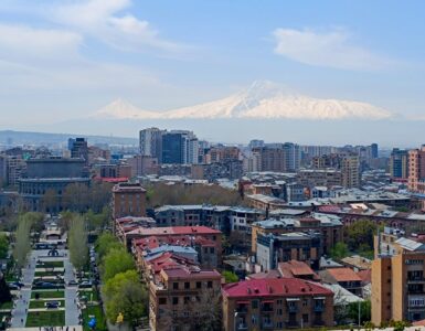Yerevan cityscape at dusk from Cascade with Mount Ararat in background, Armenia
